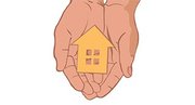 Hands holding a tiny house model